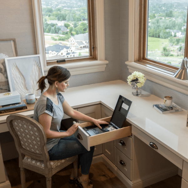 Women opening drawer with vault